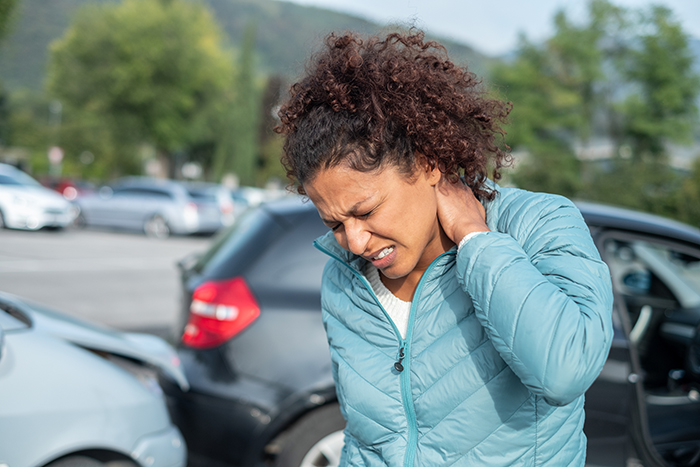 Woman Feeling Neck Ache After Bad Cars Pile Up